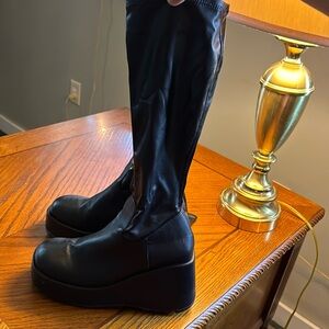 black leather boots that are like tight on skin